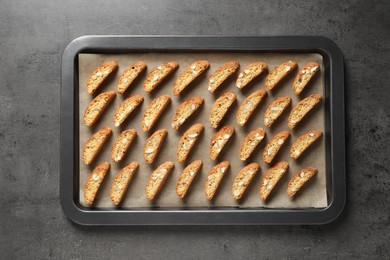 Photo of Traditional Italian almond biscuits (Cantucci) on grey table, top view