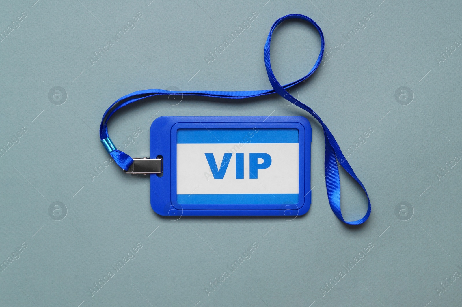 Photo of Plastic vip badge on light background, top view