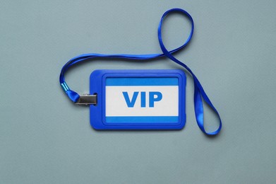 Photo of Plastic vip badge on light background, top view