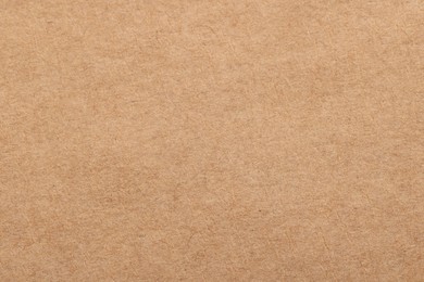 Texture of beige paper sheet as background, top view