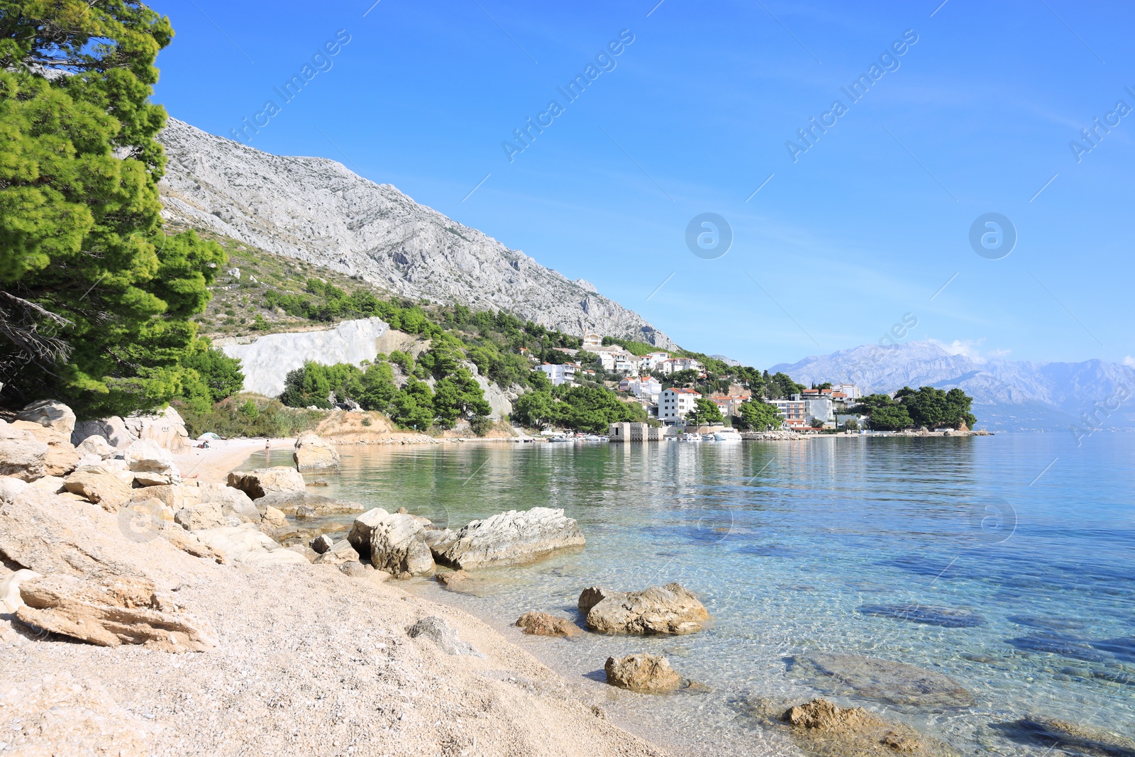 Photo of Beautiful seascape with mountains under blue sky outdoors