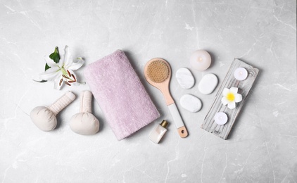 Photo of Flat lay composition with spa accessories on light background
