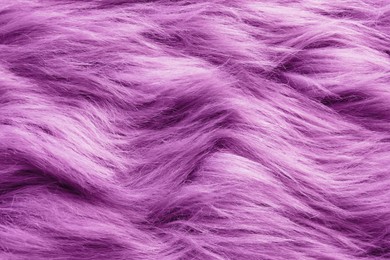 Texture of purple faux fur as background, closeup