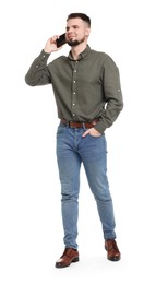 Photo of Man in shirt and jeans talking on phone on white background