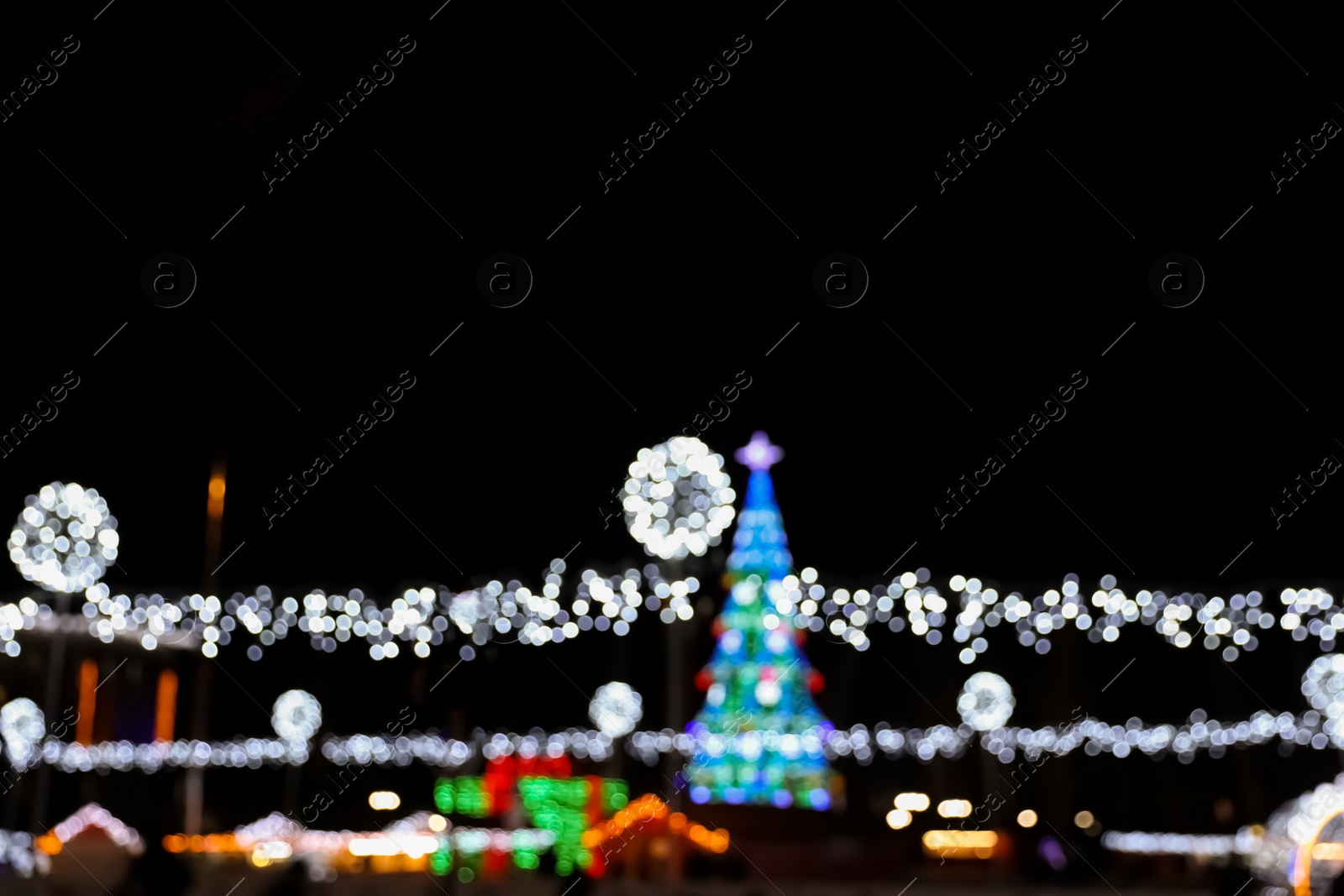 Photo of Beautiful street lights at night. Bokeh effect