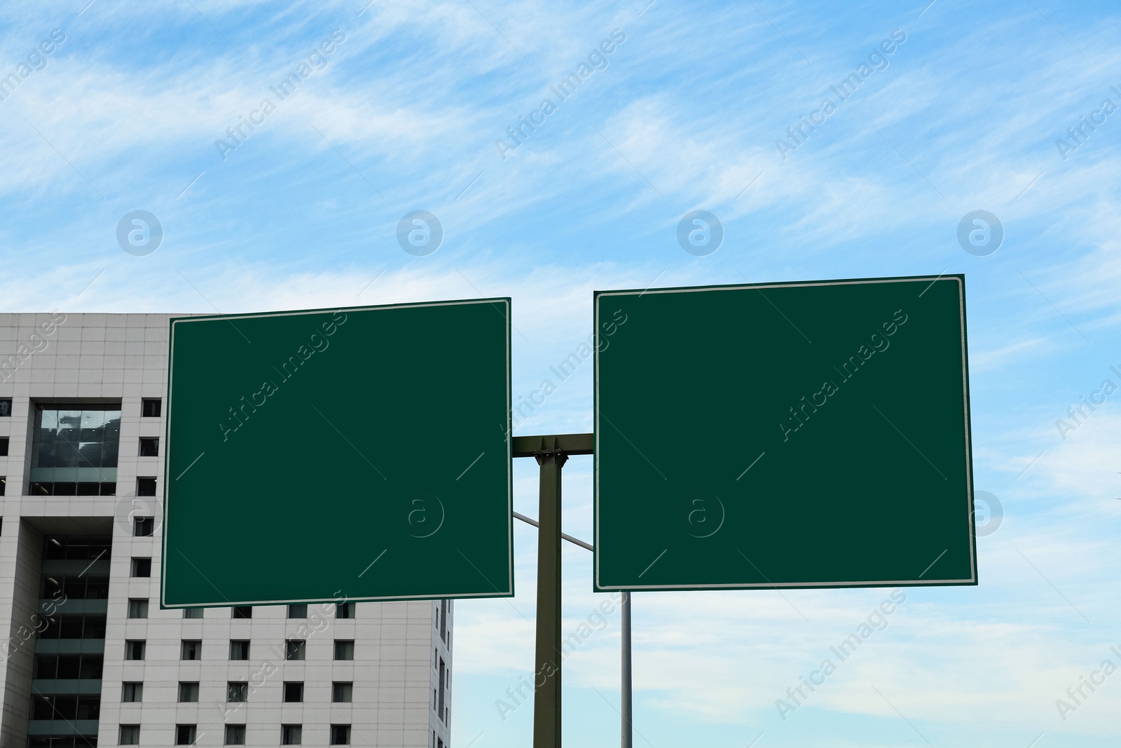 Photo of Road signs with directions on city street