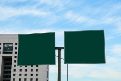 Road signs with directions on city street