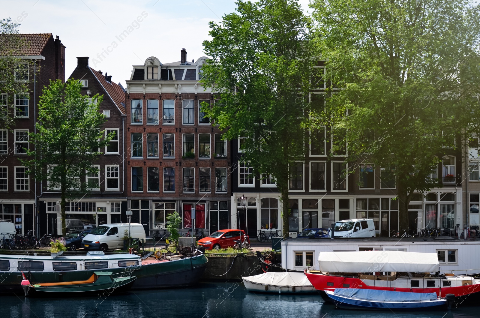 Photo of Picturesque view of town with beautiful buildings near river