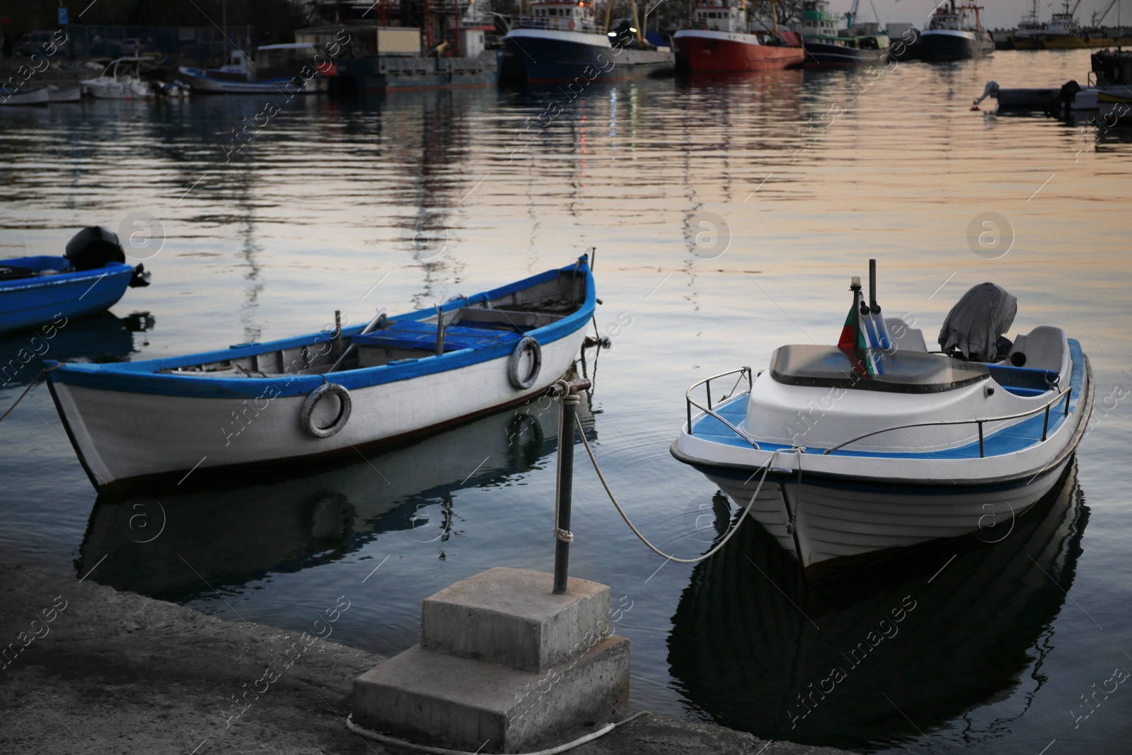 Photo of Beautiful view of river with moored boats at sunset