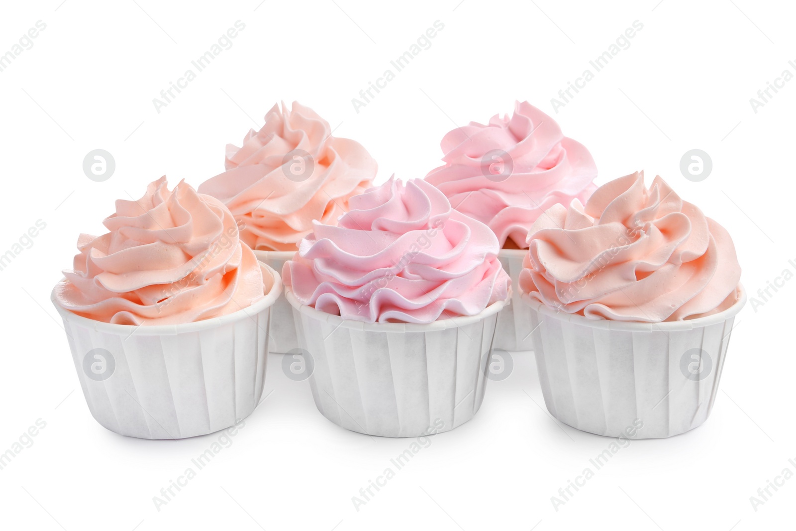 Photo of Tasty cupcakes with cream isolated on white