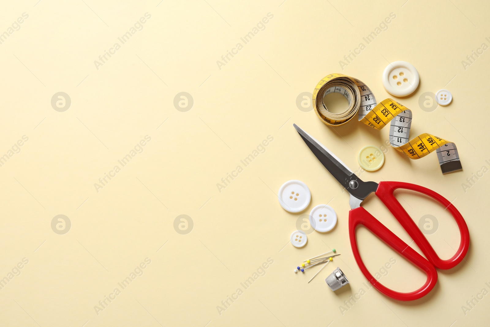 Photo of Flat lay composition with scissors on color background. Space for text