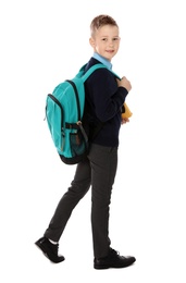 Photo of Full length portrait of cute boy in school uniform with backpack on white background
