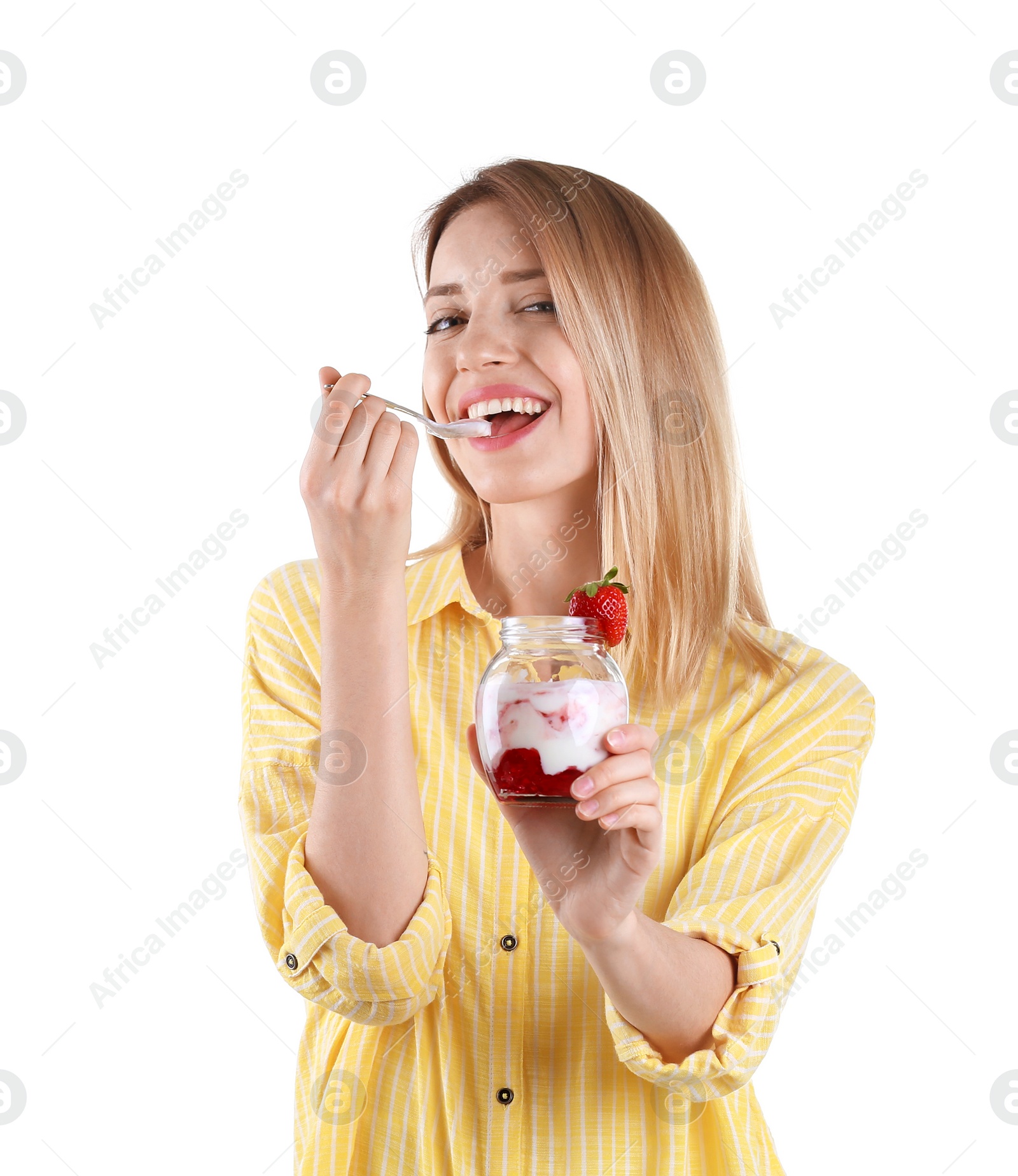 Photo of Young attractive woman eating tasty yogurt on white background