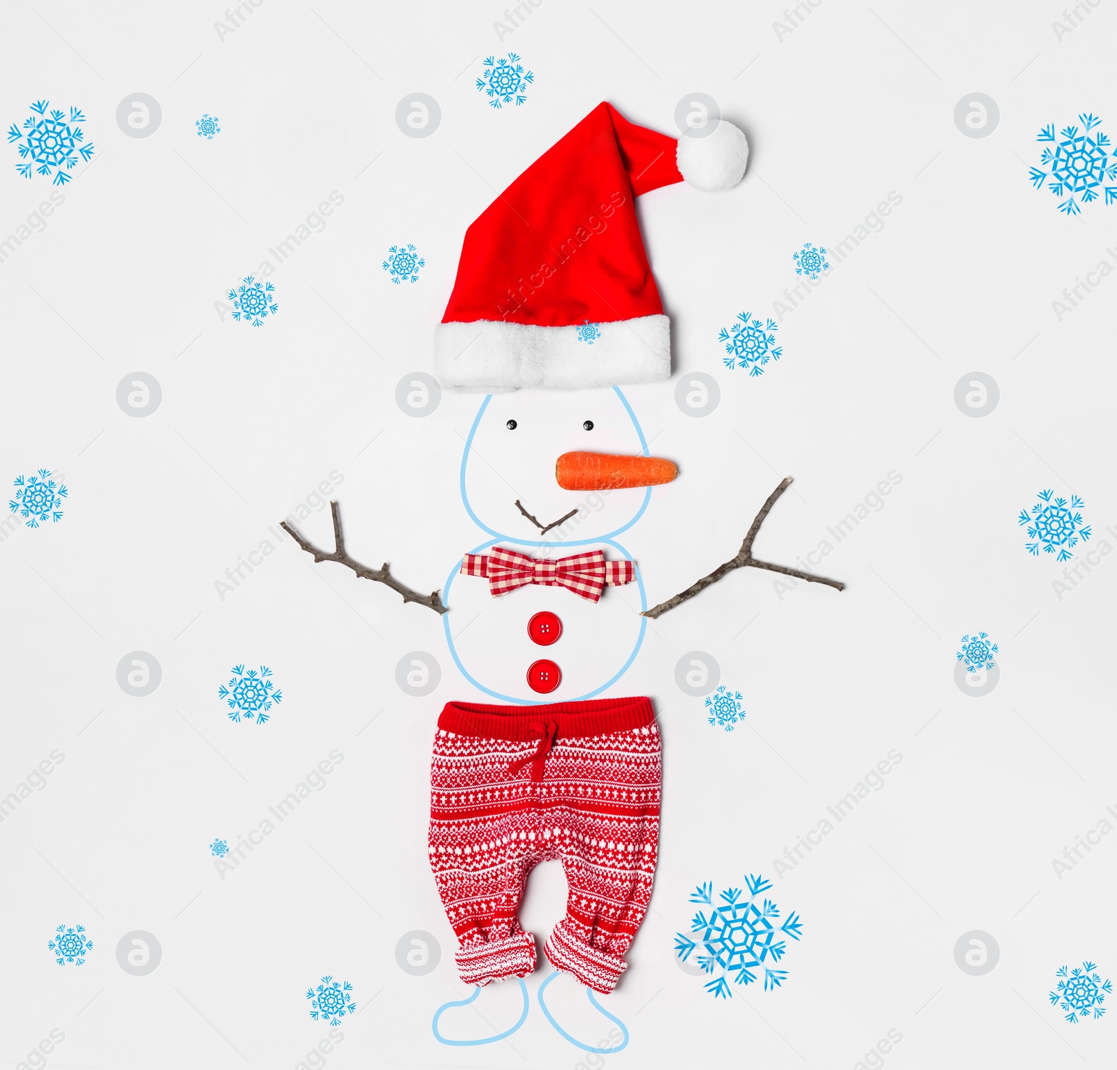 Image of Snowman with Santa hat, bow tie and small pants on white background, flat lay