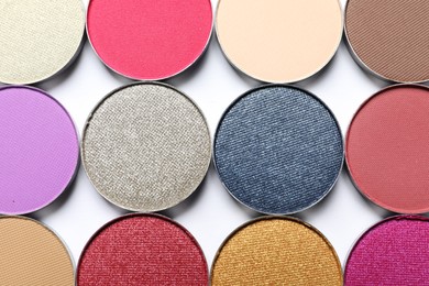 Different beautiful eye shadows on white background, flat lay