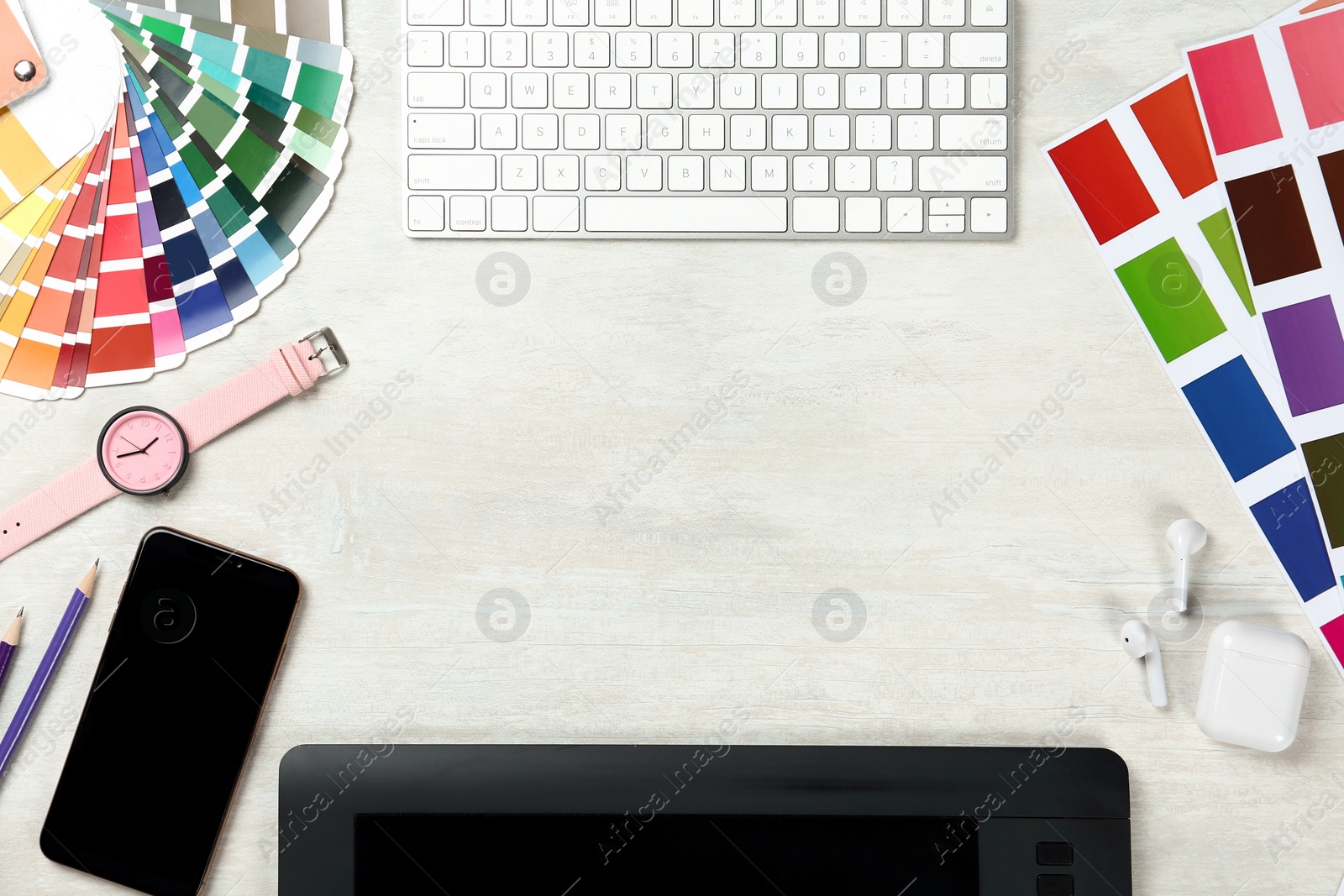 Photo of Flat lay composition with digital devices and color palettes on light background, space for text. Graphic designer's workplace