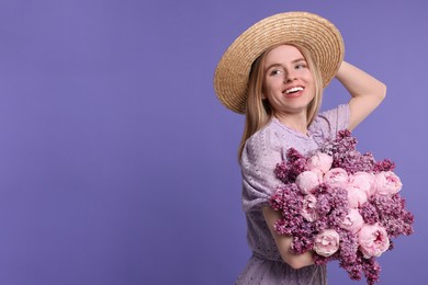 Beautiful woman with bouquet of spring flowers on purple background, space for text