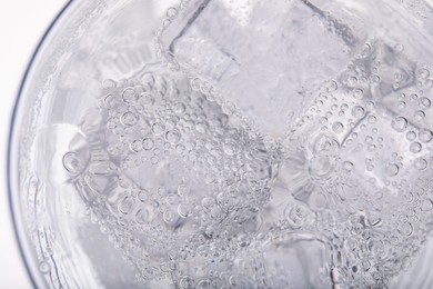 Photo of Top view of soda water with ice in glass