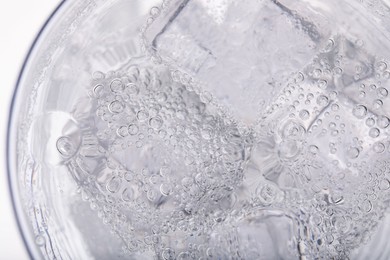 Top view of soda water with ice in glass