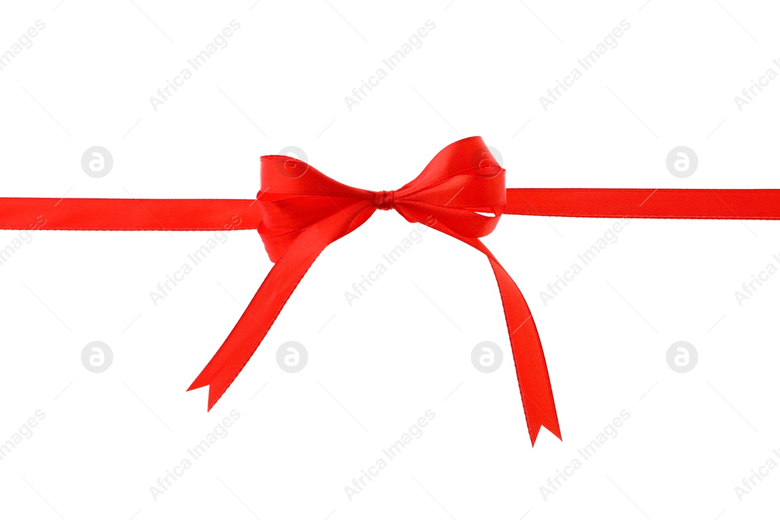 Photo of Red ribbon with bow on white background. Festive decoration