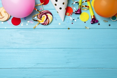 Photo of Flat lay composition with birthday party items on wooden background