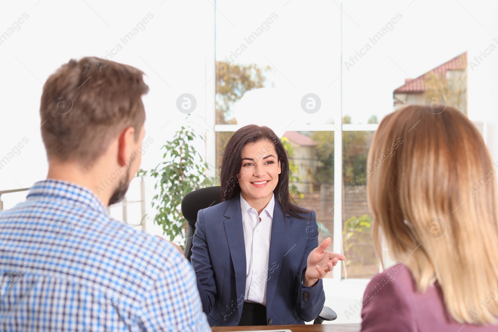 Photo of Human resources manager conducting job interview with applicants in office