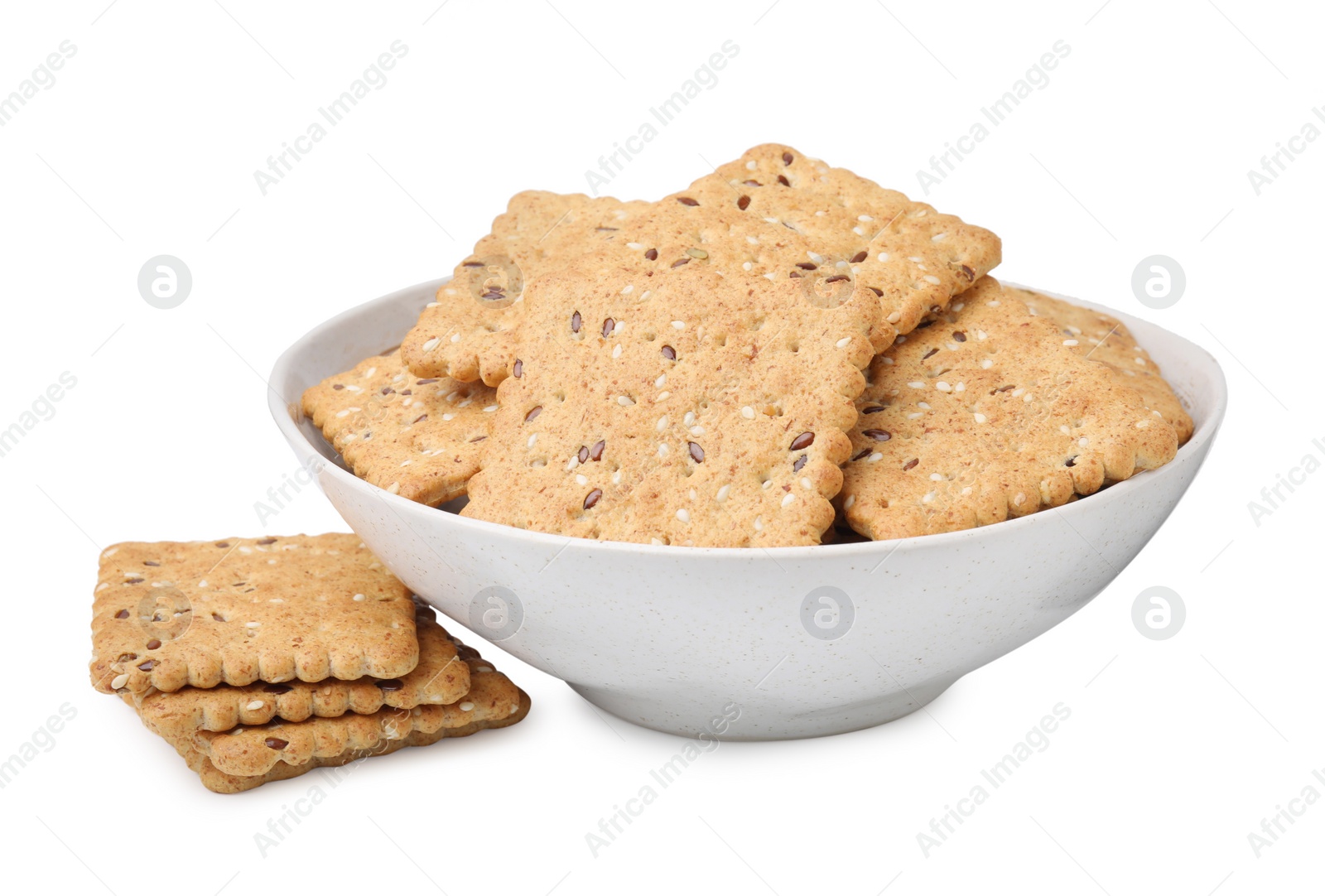 Photo of Cereal crackers with flax and sesame seeds in bowl isolated on white