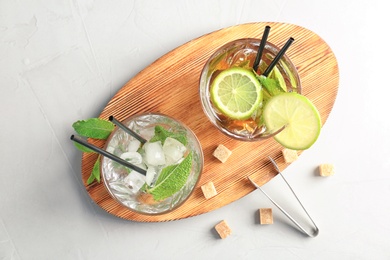 Flat lay composition with mint julep cocktail on light background