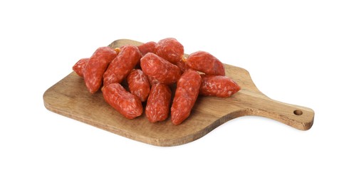Photo of Many thin dry smoked sausages with board isolated on white