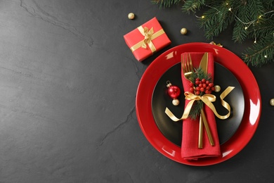 Beautiful Christmas table setting on black background, top view. Space for text