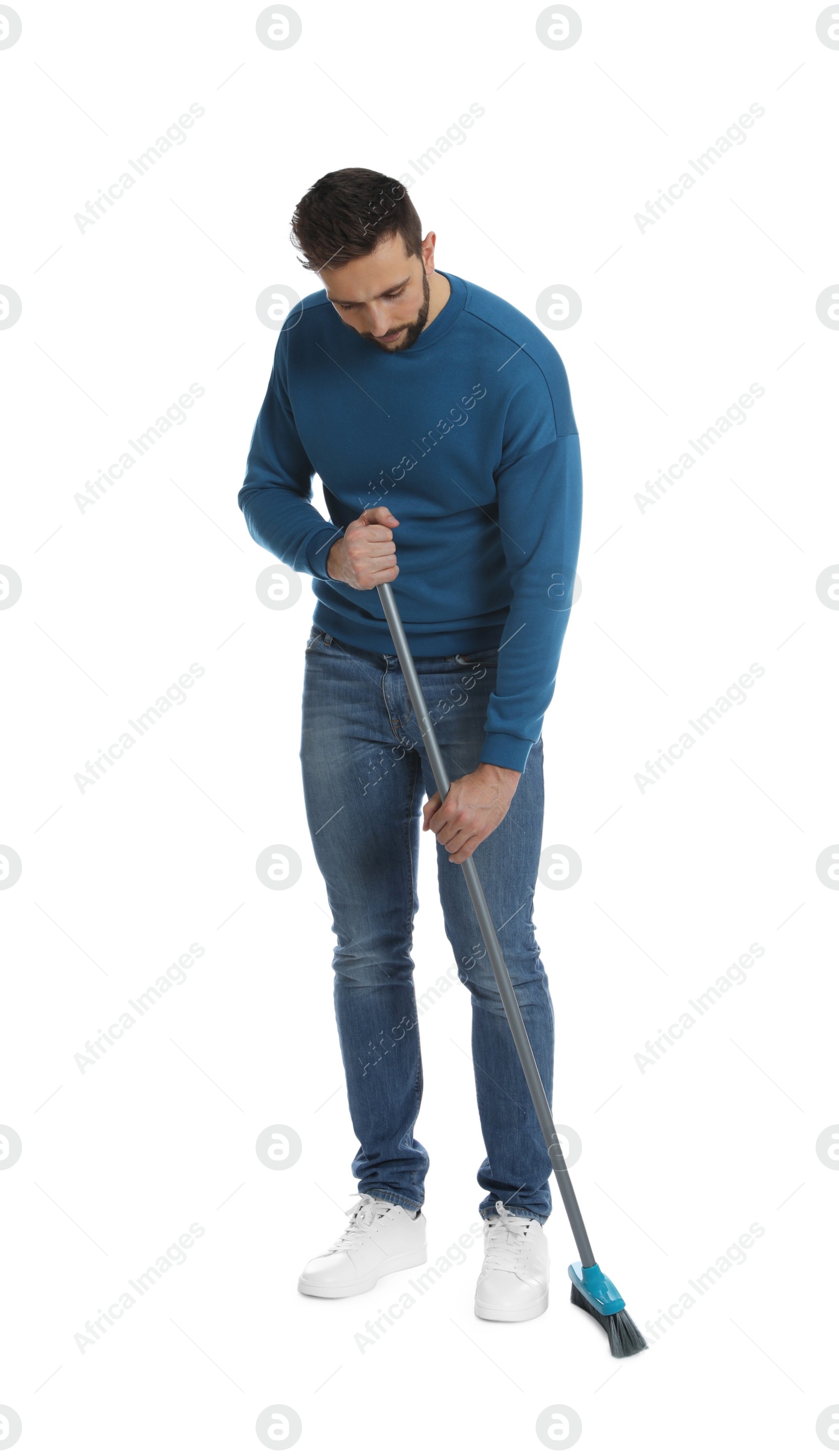 Photo of Handsome man with broom on white background