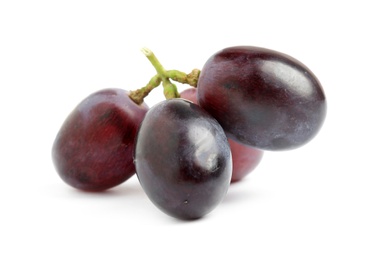 Photo of Delicious ripe purple grapes isolated on white