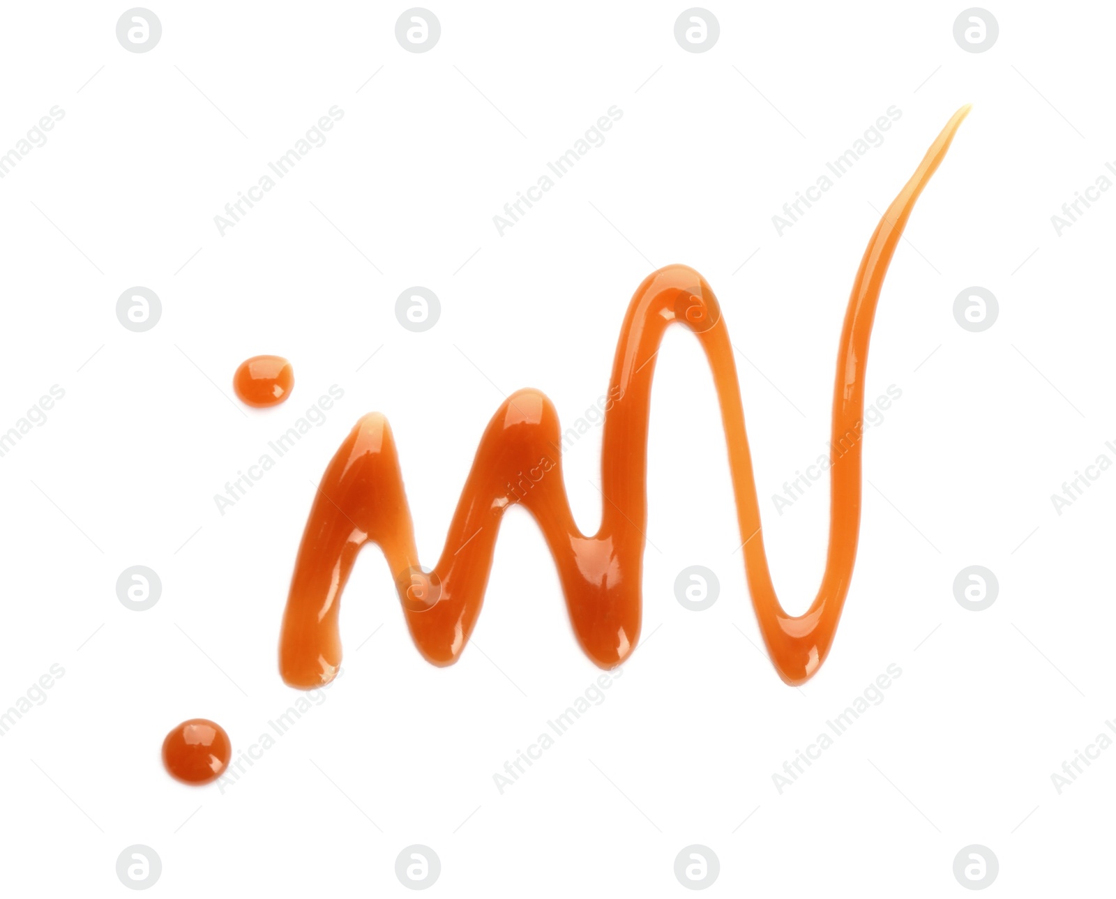 Photo of Stroke of delicious caramel sauce on white background, top view