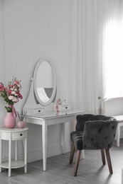Photo of Stylish room interior with white dressing table