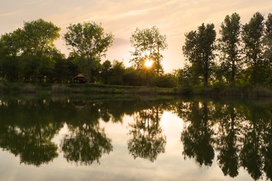 Photo of Picturesque view of lake at sunrise. Morning landscape