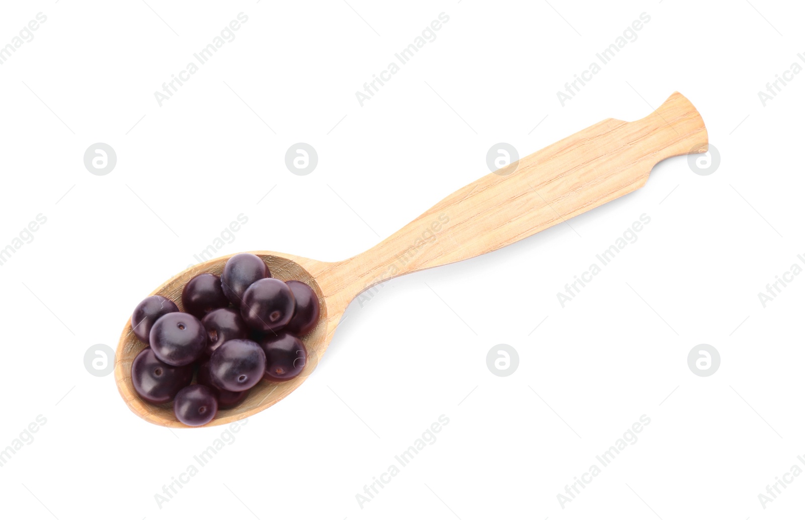 Photo of Fresh acai berries in wooden spoon isolated on white, top view