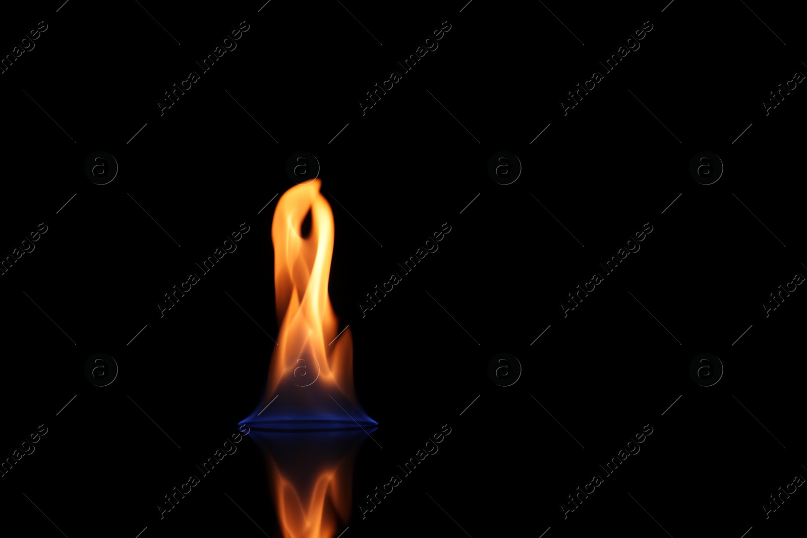 Photo of Beautiful view of flaming vodka on black background