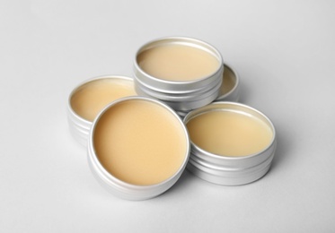 Lip balms on grey background