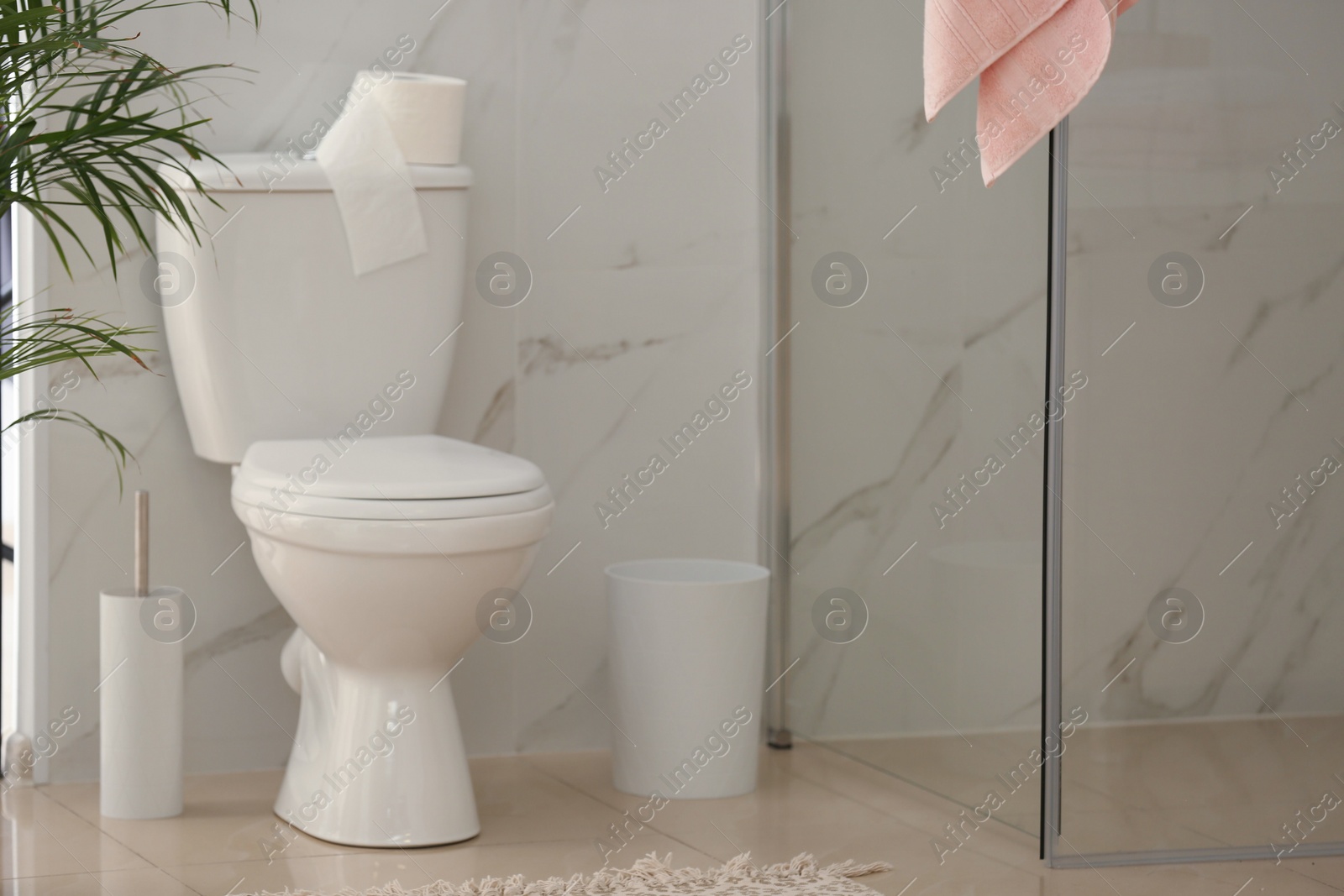 Photo of Interior of modern bathroom with toilet bowl