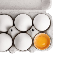 Photo of Box with chicken eggs isolated on white, top view