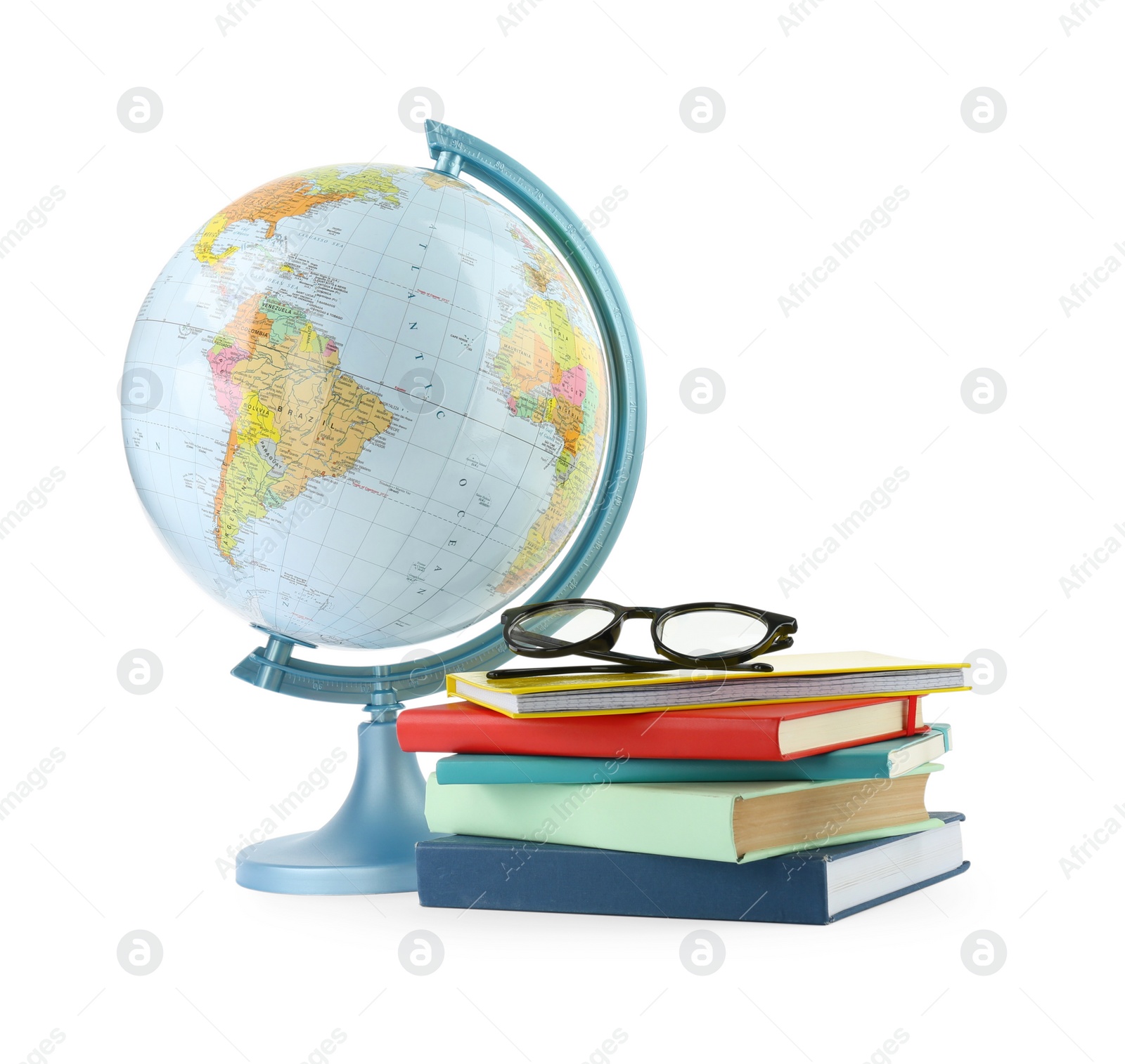 Photo of Plastic model globe of Earth, books and eyeglasses on white background. Geography lesson