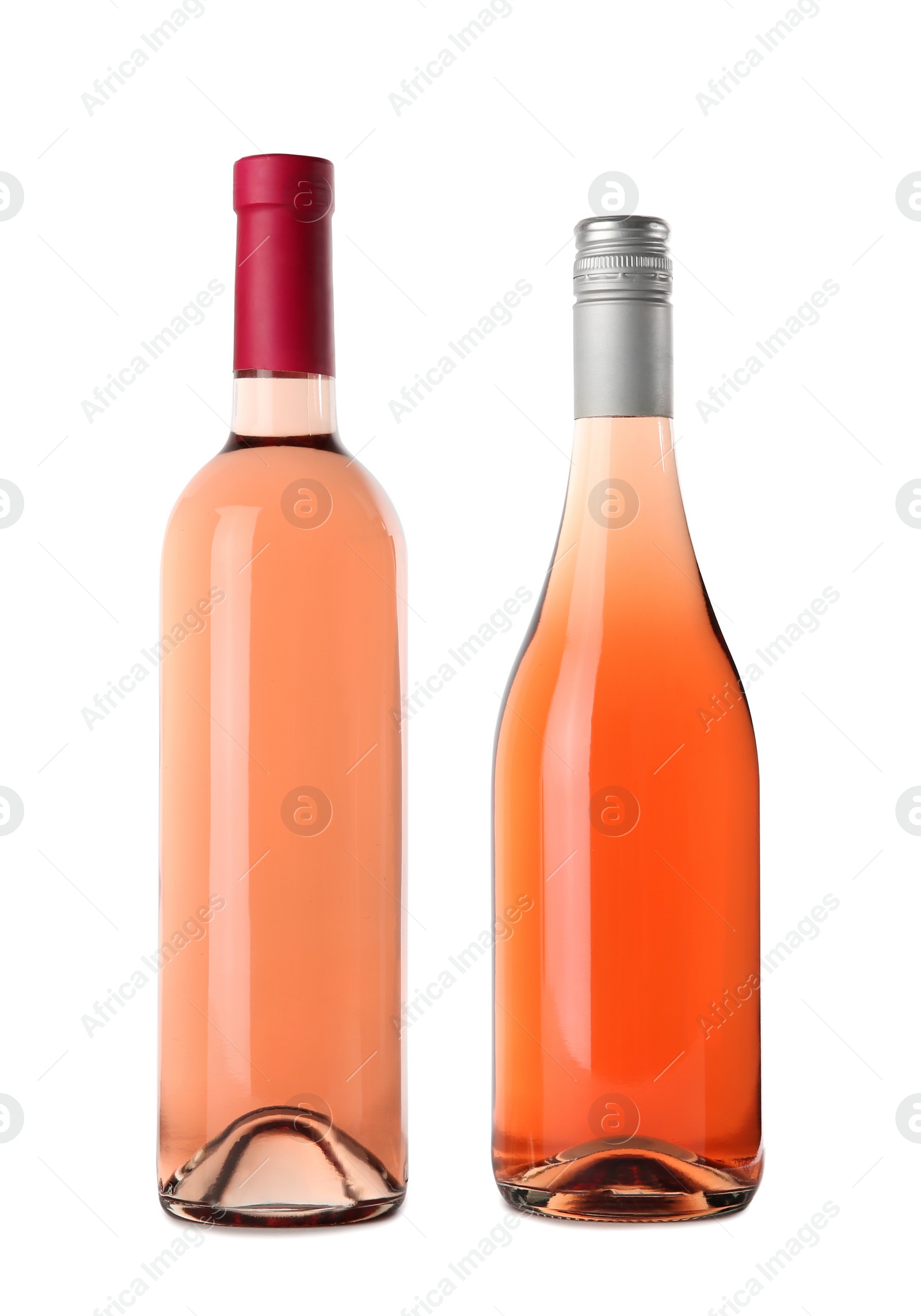 Photo of Bottles of delicious rose wine on white background. Mockup for design