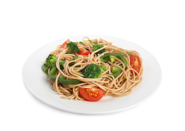 Tasty buckwheat noodles with fresh vegetables on white background