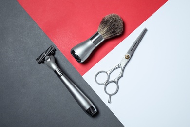 Set of shaving tools on color background, flat lay