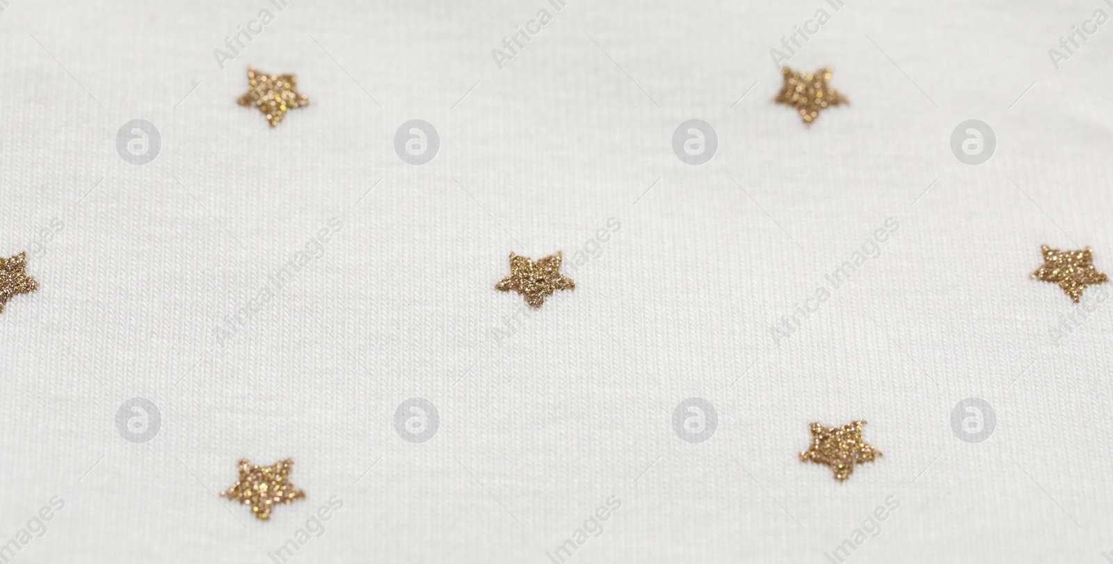 Photo of Texture of white fabric with stars as background, closeup