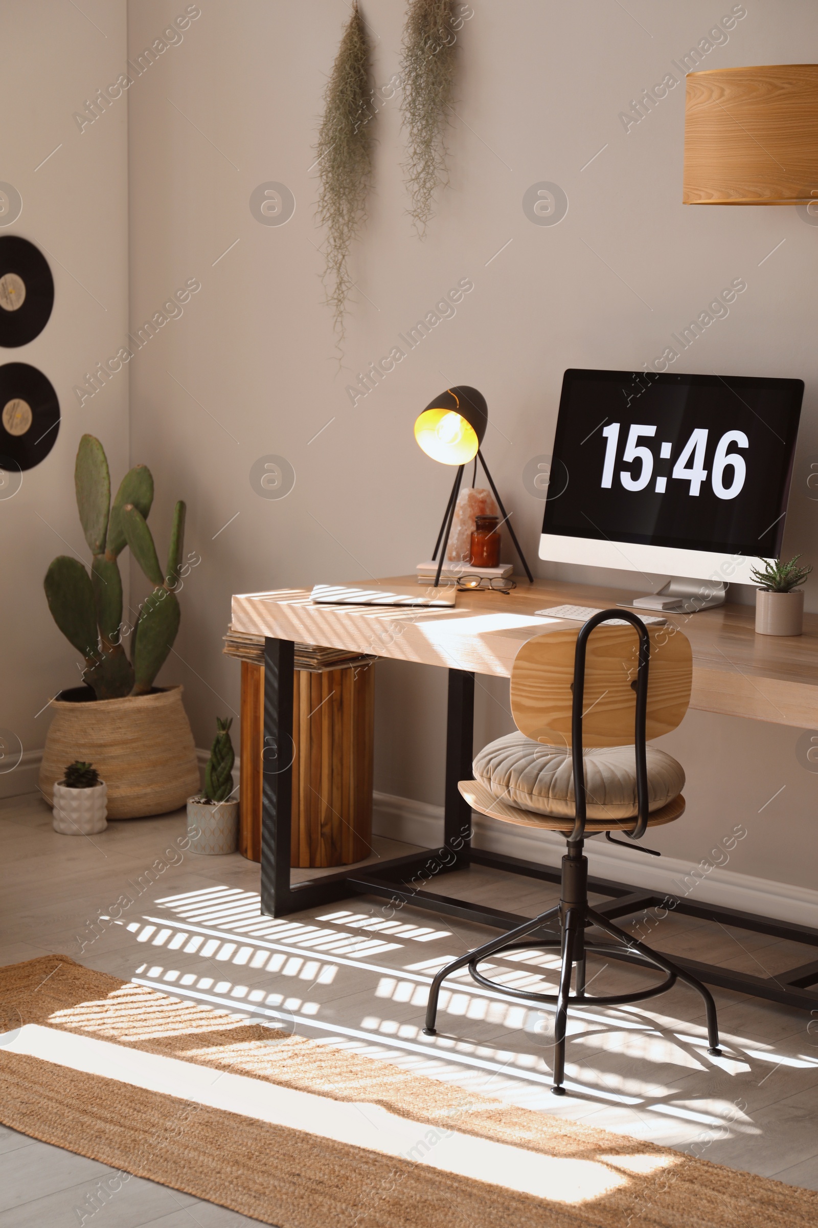 Photo of Room interior with comfortable workplace. Modern computer on wooden desk