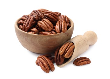 Photo of Tasty pecan nuts in bowl and scoop isolated on white