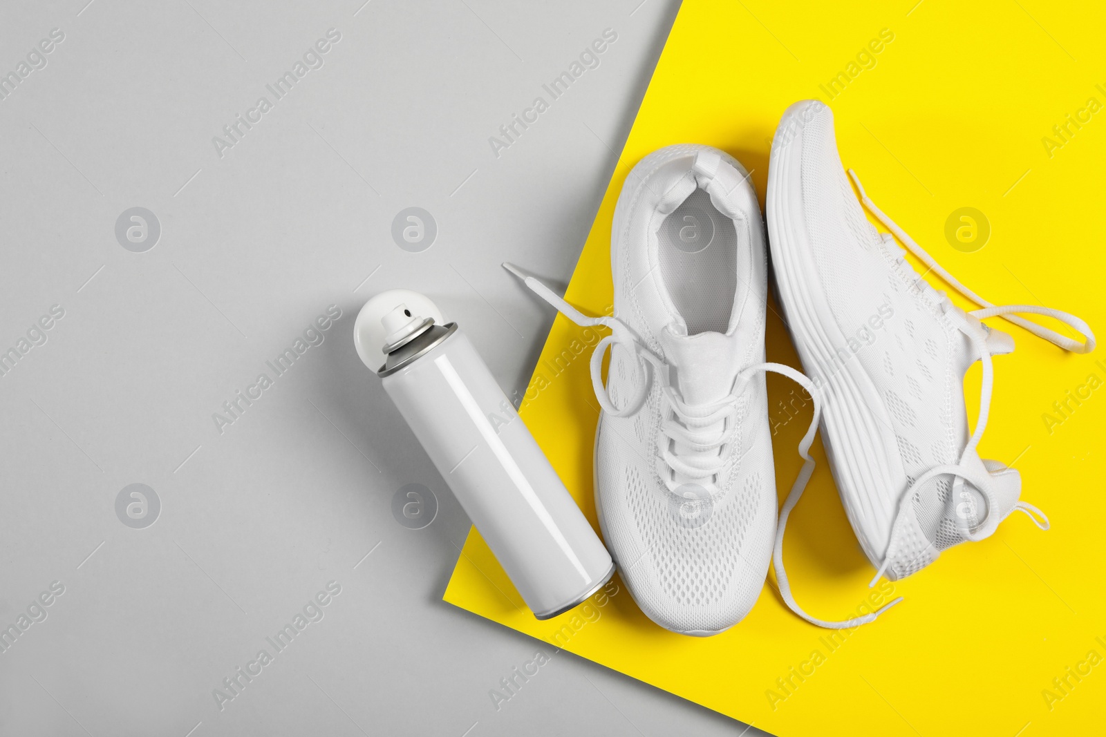 Photo of Stylish footwear and shoe care accessory on color background, flat lay