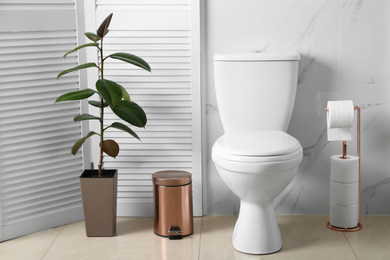 Photo of Ceramic toilet bowl in modern bathroom interior