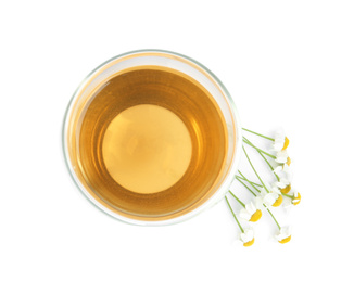 Photo of Delicious chamomile tea in glass isolated on white, top view